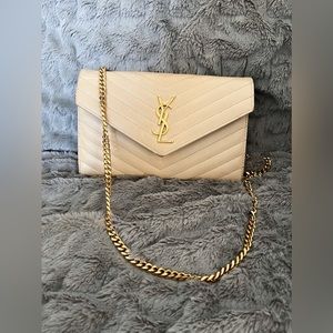 CASSANDRE MATELASSÉ CHAIN WALLET IN GRAIN DE POUDRE EMBOSSED LEATHER